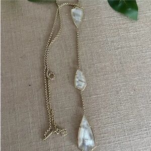 Kendra Scott 3-stone drop necklace set in gold with mother of pearl.